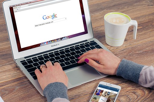 Woman searching for a business on Google while implementing SEO in Glasgow