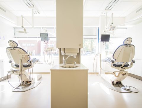 Inside clinic offering veneers in Glasgow with two dentist chairs